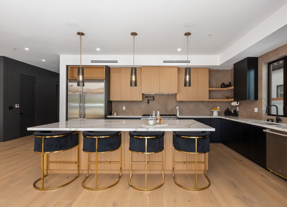 Sophisticated Kitchen Remodel with Waterfall Island and Herringbone Backsplash 1