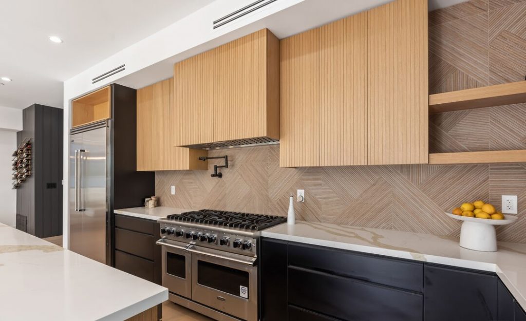 Sophisticated Kitchen Remodel with Waterfall Island and Herringbone Backsplash 3