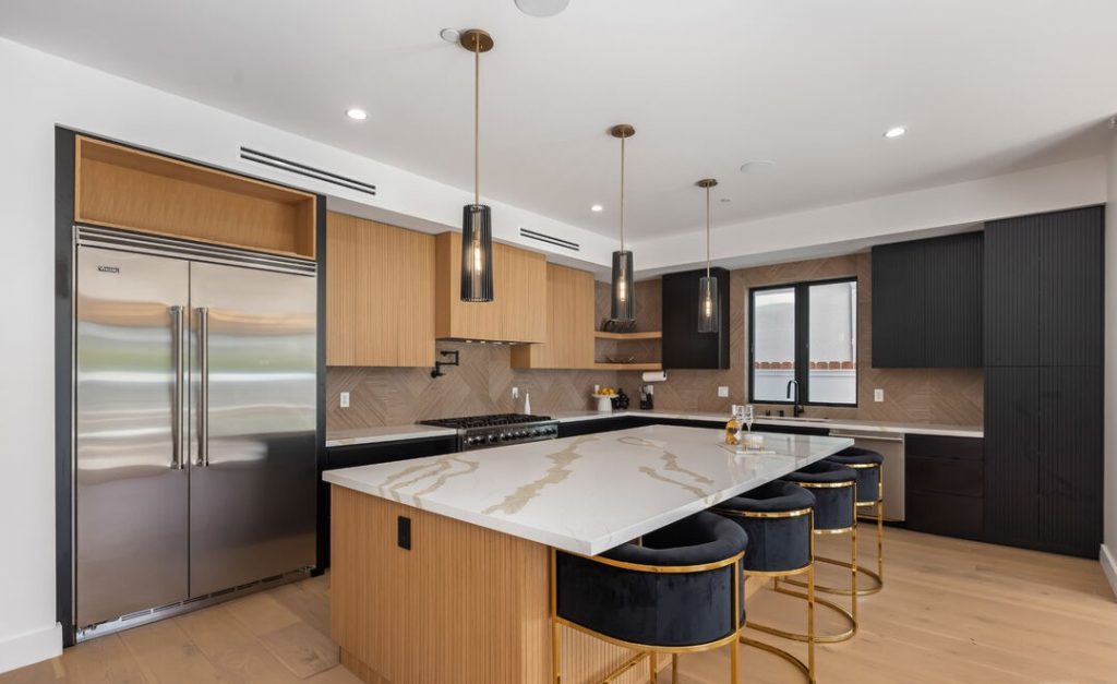 Sophisticated Kitchen Remodel with Waterfall Island and Herringbone Backsplash 5